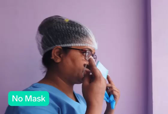 Video of the Safety Precautions example showing a woman putting her mask on with a live prediction in the bottom corner.